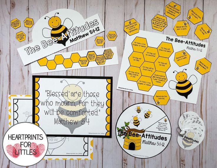 the beehive activities are displayed on a wooden table