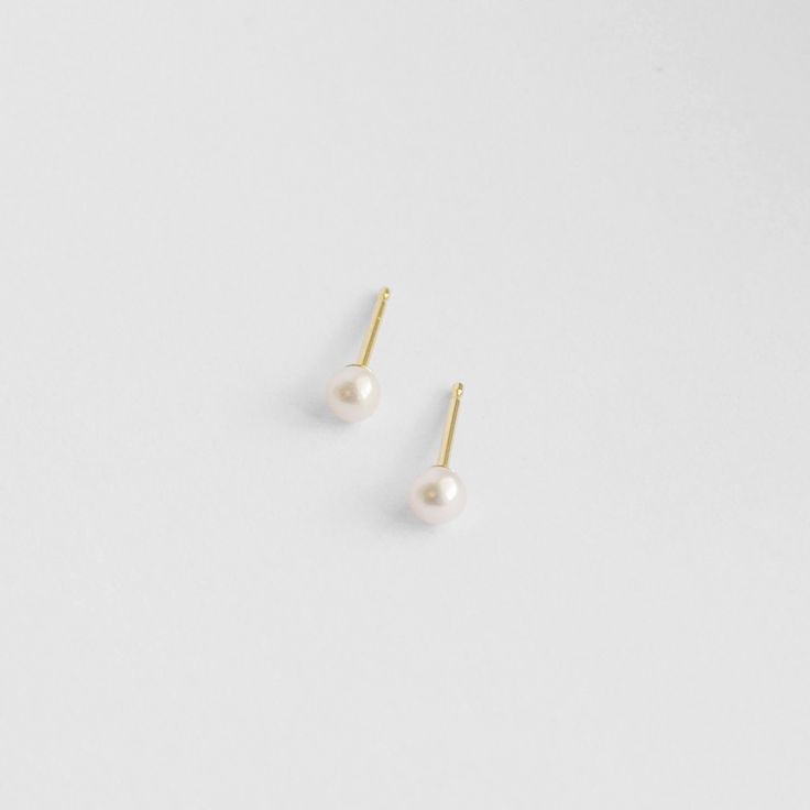 Part of our SS22 Solid Gold Collection. 3mm round pearls, each hand-selected, in a high-luster white -- check out the zoomed in model photos for a great representation of how beautiful these pearls are. A classic pearl earring in a super versatile size. Studs are solid 14k gold, and they ship with 14k gold fill backings. Classic Pearl Earrings, Pearl Earring, Gold Collection, Model Photos, Gold Studs, How Beautiful, Solid Gold, Gold Filled, Pearl Earrings