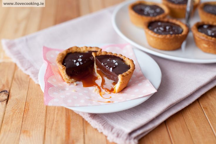 two plates with mini chocolate pies on them