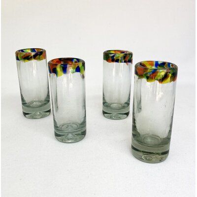 four glass vases sitting on top of a white table next to eachother