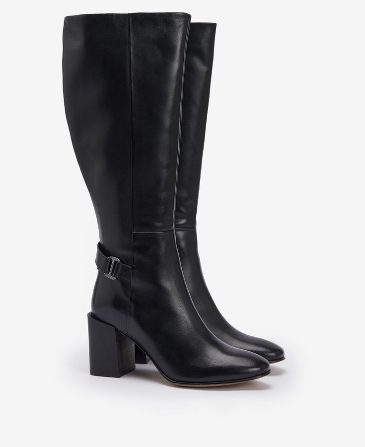 Take your outfit from day to night with the Barbour Saskia Knee-High Boots. Crafted from buttery leather, this style is sat atop a sophisticated block heel for elegance and comfort in one. Detailed with a branded buckle to the ankle and wrap-around strap, they are perfect for dressing up any outfit. Heel Tall Boots, Wellington Boot, Black Boots Tall, Tall Boot, Boots Womens, Leather Block Heels, Formal Shirts For Men, Wide Fit Boots, Wide Boots