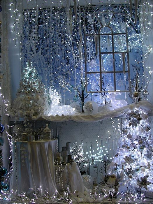 a christmas display with white lights and decorations