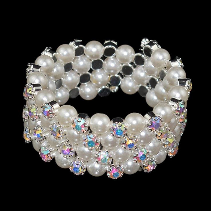 Additional Quantities Available - Contact Me Elegant, Beautiful Bracelet, All Occasion Jeweled Piece,  Stretchable Wrap Style in Pearls, Rhinestone & Crystals.  Unique Designs. Perfect for the Wedding Party, Bride, Bridesmaids. Evening Out. Styles Available: Style 26 - Silver Tone, Pearls & Crystals - 4 Rows Style 27 - Gold Tone, Pearls & Crystals - 4 Rows Style 28 - Silver Tone, Pearls, Rhinestones - 7 Rows Style 29 - Gold Tone, Pearls, Rhinestones - 7 Rows Style 30 - Silver Tone, Pearls, Rhinestones - 5 Rows Style 31 - Silver Tone, Pearls & Rhinestones - 4 Rows Style 32 - Gold Tone, Pearls & Rhinestones - 4 Rows White Party Bracelets With Rhinestones, White Rhinestone Bracelets For Party, Party White Crystal Bracelet With Rhinestones, White Rhinestone Crystal Bracelet For Party, White Crystal Bracelet With Rhinestones For Party, White Crystal Rhinestone Bracelet For Party, White Crystal Bracelet For Party, Bracelets Pearls, Pearl Cuff Bracelet