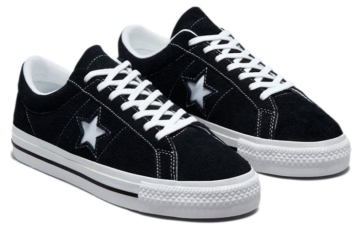 Known for decades as part of the Converse family, the One Star Low 'Black White' sneaker provides a classic style with modern performance features. Originally releasing in 1974, this timeless design is now proudly reincarnated with improved comfort, versatility, and durability. Its low profile and rubber-backed suede upper give maximum flexibility without compromising protection or sturdiness. While looking stylish on city streets, this sneaker also delivers remarkable boardfeel and impact suppo Converse With Stars, Converse Shoes High Top, Converse One Star Black, Basic Sneakers, Black And White Converse, All Star Converse, Converse Low, Star Converse, Converse Star