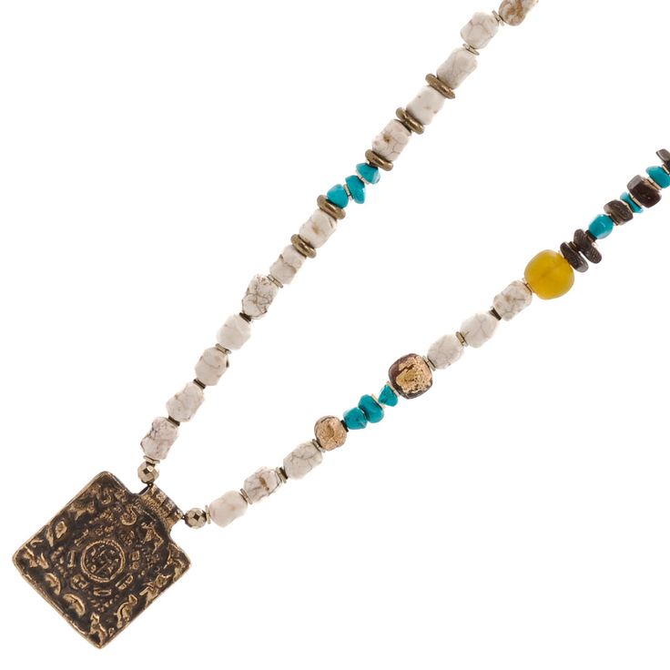 Ethnic Nepal Om Necklace is a beautiful expression of Nepal's rich cultural heritage and spiritual traditions. Its intricate design and meaningful symbolism make it a unique and treasured piece of jewelry. Whether worn for a special occasion or as a daily accessory, the Ethnic Nepal Om Necklace is sure to make a statement and inspire a sense of peace and mindfulness. The Ethnic Nepal Om Necklace is a stunning piece of jewelry that showcases the rich cultural heritage of Nepal. The necklace featu Adjustable Gemstone Beads Jewelry For Blessing, White Gemstone Beads Jewelry For Festival, One-of-a-kind Medallion Necklace For Festivals, Traditional One-of-a-kind Necklace For Festival, Traditional Beaded Festival Jewelry, Spiritual Round Beads Jewelry For Festivals, White Amulet Jewelry For Meditation, Bohemian Multicolor Brass Necklaces, Hand-strung Round Beads Amulet Jewelry