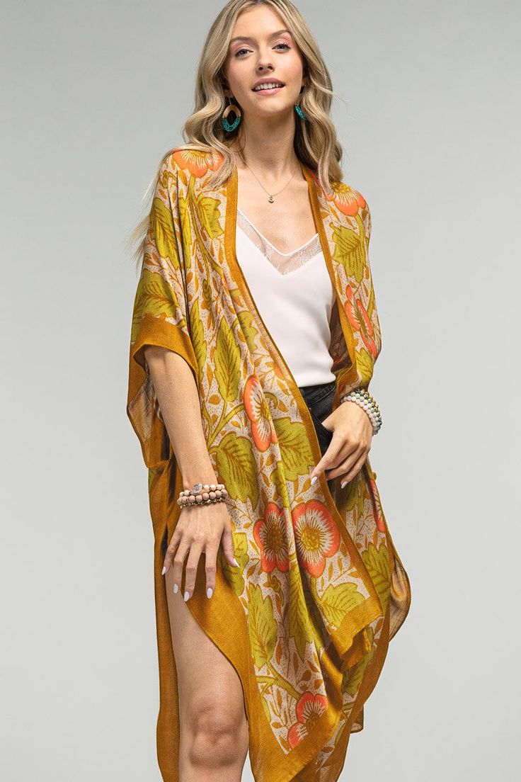 Introducing the Hilary Kimono - a stunning piece that combines vintage charm with modern elegance. Its airy fabric is adorned with a gorgeous floral and leaf print, while side slits add a touch of movement. Elevate any outfit with this unique and versatile kimono. *100% Viscose*APPROX. L 38" W 40" Oversized Kimono, Madewell Style, Bohemian Kimono, Anthropologie Style, Floral Print Kimono, Beach Kimono, Blue Kimono, Free People Style, Shawl Cardigan