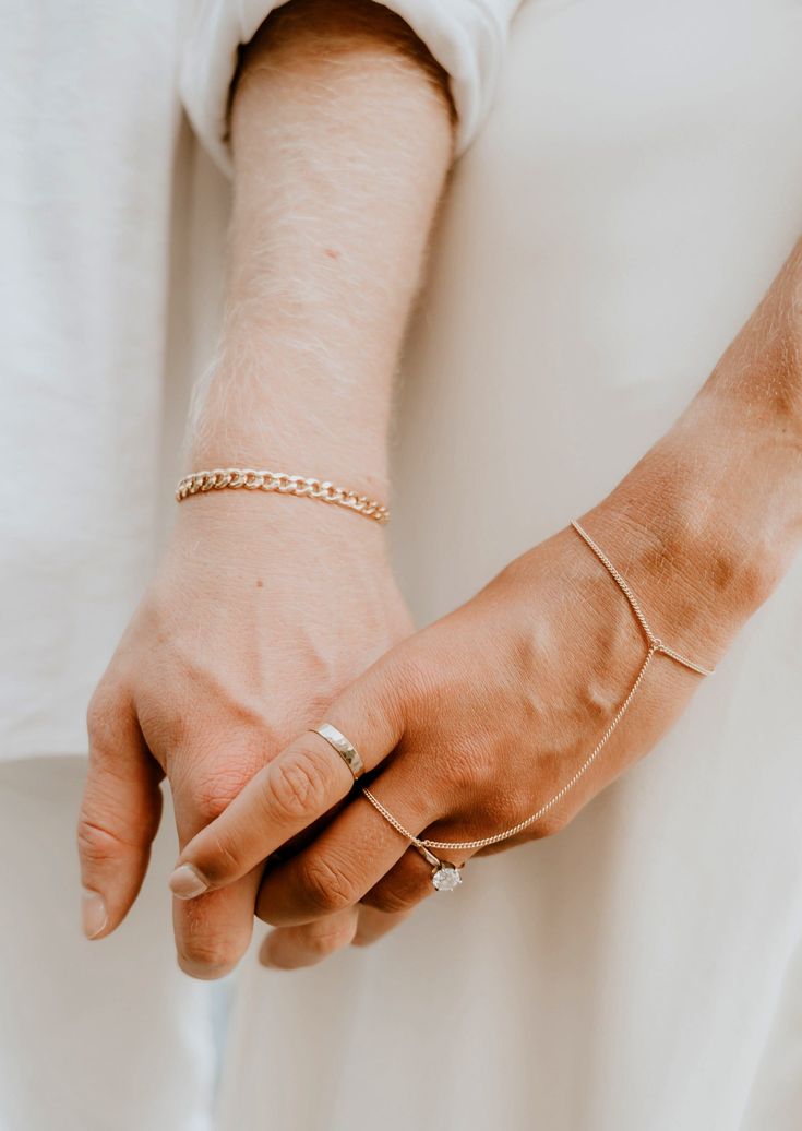 Channel your inner bohemian with this hand chain that loosely drapes around your finger and wrist. Whether you’re at a music festival or brunch with the girls, this hand candy turns any outfit into magic. Bracelet is 6" with a 1" extender. S/M: ring size 5-7.5, wrist size 6-7" M/L: ring size 8-10.5, wrist size 7-7.5" Available in 14kt Gold Fill + Sterling Silver. Handmade in Eau Claire, WI. Our jewelry is handmade so each piece will be unique and may vary slightly from what is pictured. Bohemian Wedding Bracelets With Adjustable Chain, Bohemian Wedding Bracelet With Adjustable Chain, Adjustable Chain Body Jewelry For Festivals, Gold Bracelets With Adjustable Chain For Festival, Hand Wrapped Bracelet Jewelry For Party, Dainty Summer Bracelet With Adjustable Chain, Dainty Summer Bracelets With Adjustable Chain, Bohemian Hand Wrapped Bracelets For Party, Elegant Adjustable Chain Bracelet For Festivals