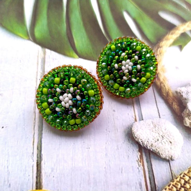 These bead embroidery green kiwi earrings studs would make a perfect and unique gift for family, friend, or yourself. ★DIMENSIONS: 2.5*2.5 cm (0.98*0.98 Inches) ★READY TO SHIP Made with love and care about you!♥ ★The colors can slightly differ from the photo because of photography lighting and monitor settings. ★ESTIMATED SHIPPING TIMES: North America: 2-4 weeks Europe: 1-3 weeks Australia, New Zealand and Oceania: 3-5 weeks Asia Pacific: 2-4 weeks Latin America and the Caribbean: 3-5 weeks North Africa and the Middle East: 3-5 weeks Sub-Saharan Africa: 3-5 weeks ★PLEASE NOTE: I accept payments through Paypal * you no need to have an account* by credit or debit card. 1. Click Check out with PayPal and you'll be redirected to PayPal. Instead of choosing to pay with your PayPal account, sele Gift Beaded Round Clip-on Earrings, Green Round Beaded Earrings As Gift, Round Beaded Clip-on Earrings Gift, Green Round Clip-on Earrings As Gift, Green Round Beaded Earrings For Gift, Round Green Beaded Earrings As Gift, Beaded Round Clip-on Earrings Gift, Green Round Clip-on Earrings For Gift, Handmade Green Clip-on Earrings As Gift