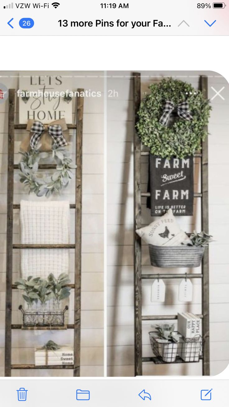 an old ladder is used as a shelf for towels and wreaths in this farmhouse style bathroom