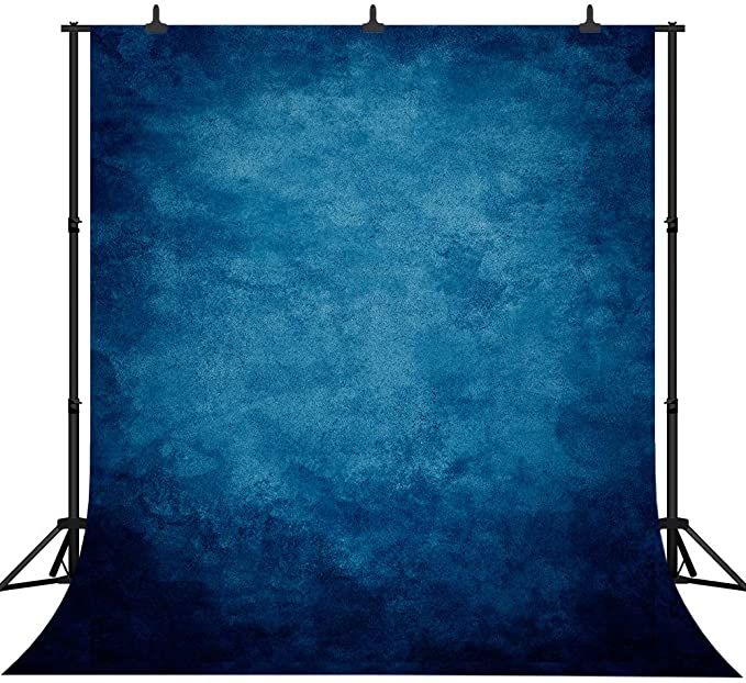 an image of a blue backdrop with black metal frame and lighting stand on white background