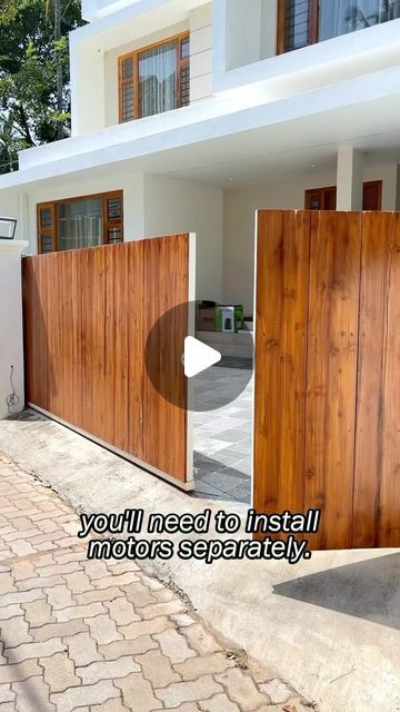 an image of a house with wooden gates