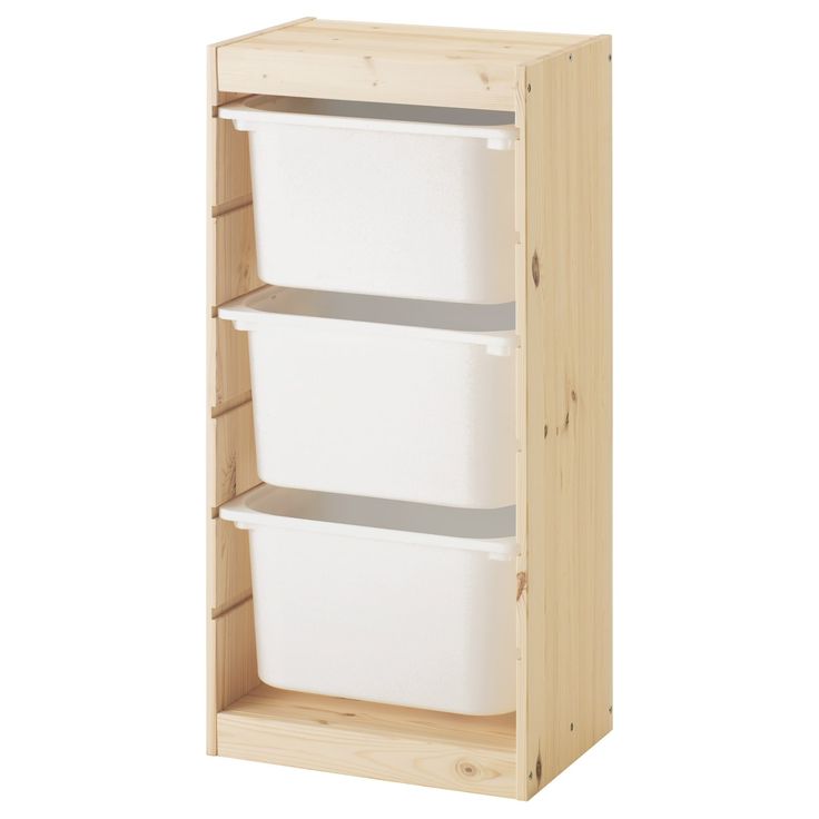 a wooden shelf with two white bins on top and one is open to show the bottom