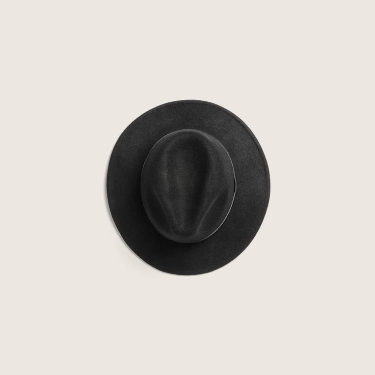 Hand made from soft 100% Australian wool, William Black is one of our most approachable and versatile wide brim styles. With a 6.5cm under welted rolled edge that can be worn up or down and finished with our signature embossed leather band accessory. It's the style that started it all and one of our favourite styles for both men and women. This hat is packable and ideal for travelling on your next adventure. Everyday Leather Fedora With Curved Brim, Everyday Leather Fedora With Short Brim, Formal Leather Felt Hat With Short Brim, Classic Solid Color Felt Hat For Everyday, Formal Leather Wide Brim Felt Hat, Black Leather Fedora Felt Hat, Black Leather Felt Hat With Short Brim, Classic Black Leather Fedora, Black Leather Felt Hat With Curved Brim