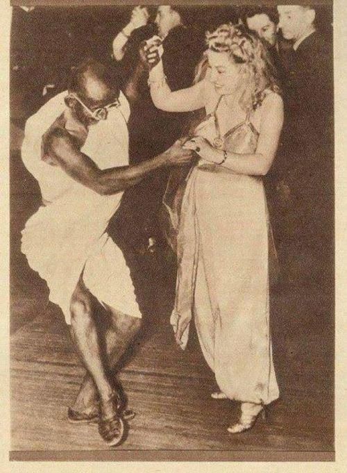 an old black and white photo of two people dancing