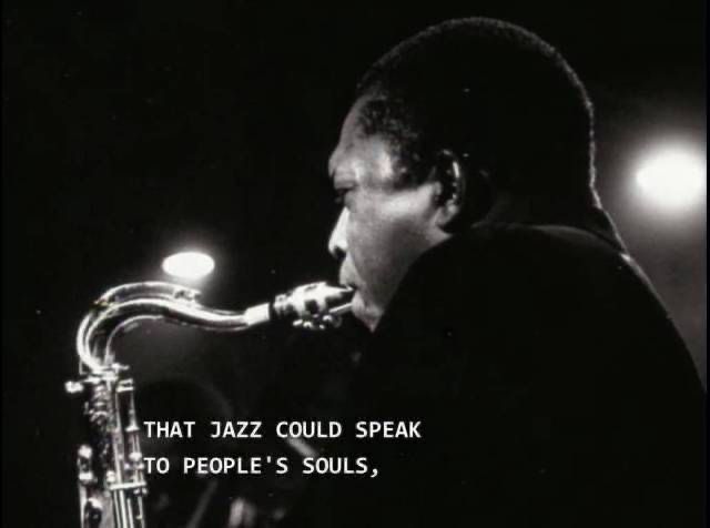 a black and white photo of a man playing the saxophone with a quote on it