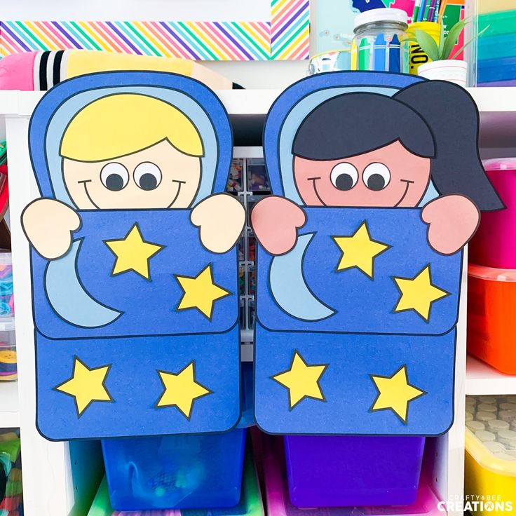 two children's bookends made out of cardboard with stars on them