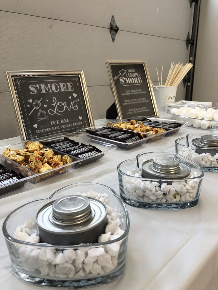 the table is set up with desserts and snacks