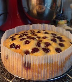 a cake sitting on top of a metal rack