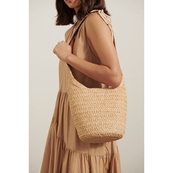 Natural Bucket Bag With Intrecciato Weave, Summer Rectangular Bucket Bag With Intrecciato Weave, Chic Summer Straw Bag With Intrecciato Weave, Beach Straw Bag With Intrecciato Weave In Natural Color, Spring Intrecciato Weave Straw Tote Bag, Elegant Crochet Bag With Intrecciato Weave In Natural Color, Natural Crochet Bag With Intrecciato Weave For Travel, Beach Basket Straw Bag With Intrecciato Weave, Brown Intrecciato Weave Straw Bag For Summer