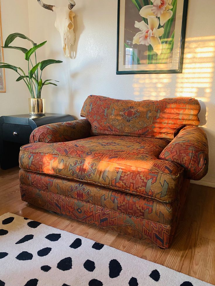 a living room with a couch and rug