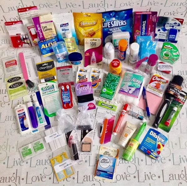 the contents of a bed spread out on top of each other, including toothbrushes and lotion