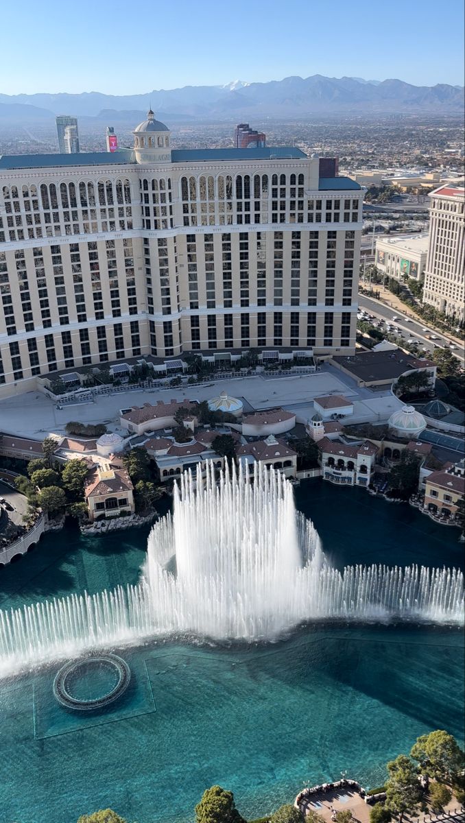 an aerial view of the las vegas hotel and casino from above, with fountains in front