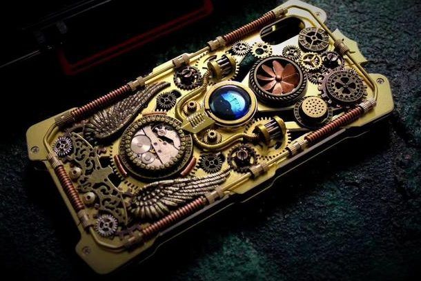 an iphone case made out of gears and other mechanical parts is shown in this image