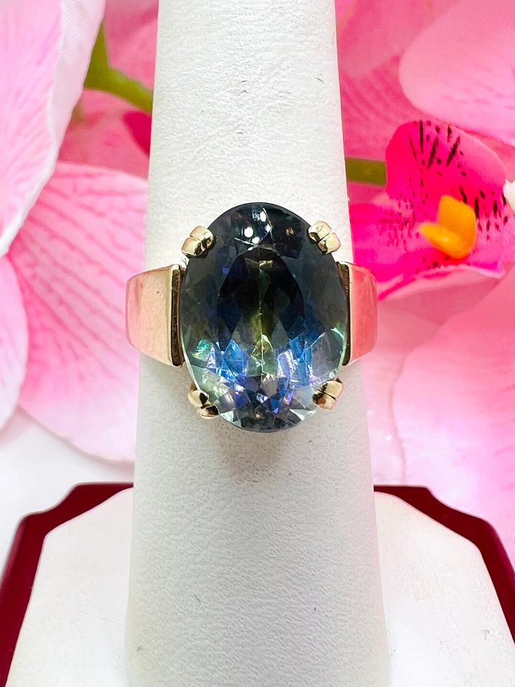 14K Yellow Gold Synthetic Alexandrite Cocktail Ring Size 7 A perfect gift for your loved one for any special occasion or holiday! Total Ring Weight: 11.50g Ring Length: 27.29mm Ring Width: 20.19mm Gemstone: Synthetic Alexandrite Item will be placed into a gift box. * High Luster Oval Ring In 14k Gold, High Luster 14k Gold Oval Rings, 14k Gold High Luster Rings As A Gift, 14k Gold Rings With High Luster For Gift, Fine Jewelry Rings As Gift With High Luster, High Luster 14k Gold Rings For Gift, Elegant Iridescent Rings With Accent Stones, Iridescent Fine Jewelry Ring For Anniversary, Iridescent Gemstone Rings In Fine Jewelry Style