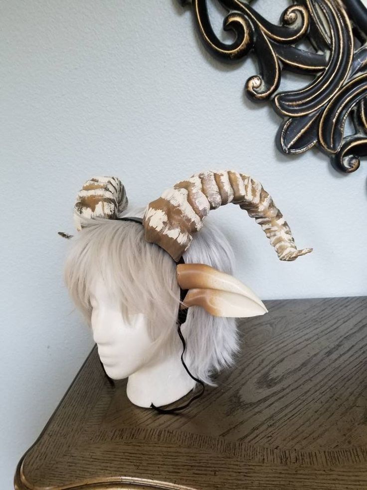 "HORNS AND EARS SET! Whether it's a satyr, forest nymph, role play or just for fun, these horns are hot. They are mounted onto a 0.5inch teethed headband and the ears are removable! Though fantastic to behold and incredibly detailed, No other set like this will come close to being as light! Like everything else we develop, they are easy to wear and extremely comfortable when on, for hours of use (some even forget that they are wearing anything at all and don't take our word for it. Read our revi Fantasy Horns, Horn Ideas, Horns Headband, Cosplay Horns, Goat Horns, Fair Outfits, Horn Headband, Ram Horns, Cosplay Diy