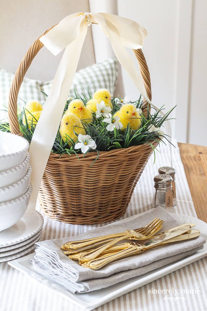 easter basket centerpiece with yellow flowers in it