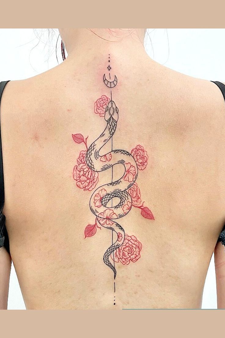 a woman's back with a snake and roses tattoo on her left side ribcage