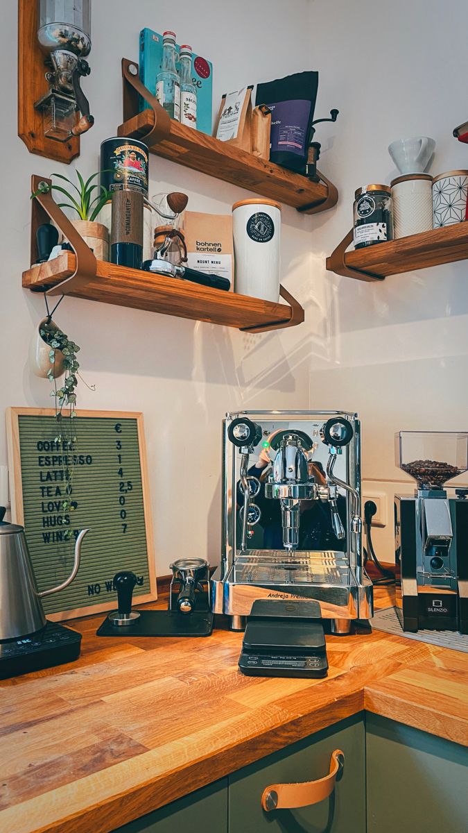 there is a coffee maker on the counter in this kitchen with wooden shelves above it