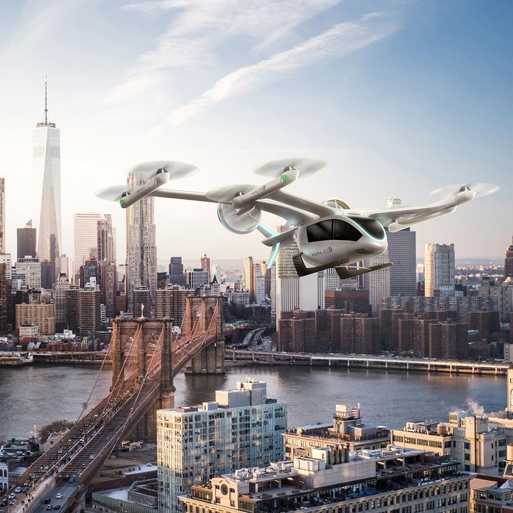 an aerial view of a city and a flying aircraft