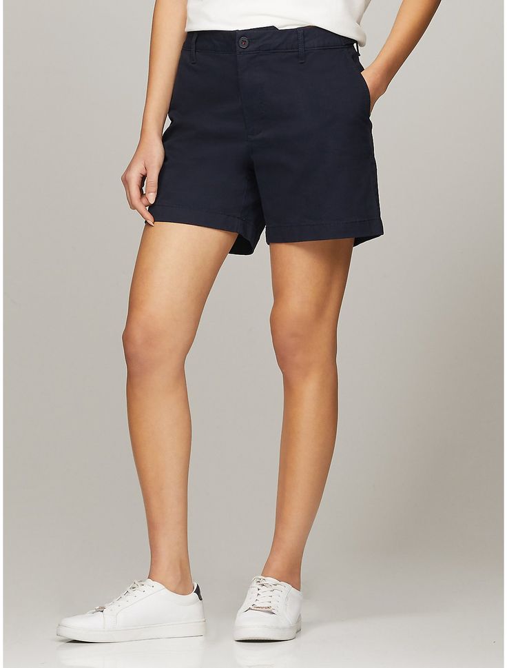 Tommy Hilfiger women's short. Made from soft, stretch fabric and cut in an easy fit, our go-to short is comfortable and flattering.  Material: 77% Cotton, 20% Reprocessed Cotton, 3% Elastane. Workwear Bermuda Shorts, Casual High-waisted Bermuda Shorts For Work, Casual Relaxed Fit Tommy Hilfiger Bottoms, Cotton Workwear Shorts, Classic Solid Bermuda Shorts, Solid Relaxed Fit Bermuda Shorts, Casual Mid-rise Bottoms By Tommy Hilfiger, Tommy Hilfiger Stretch Cotton Bottoms, Stretch Mid-rise Cotton Bermuda Shorts