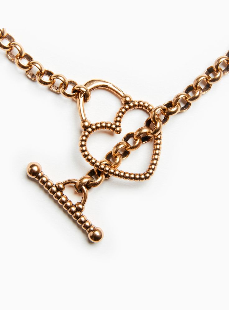 Carine offers a more sophisticated interpretation to the style of our Elisa design—daring to wear her delicate heart at the end of a chain for all to see. Loop the rolo chain through the heart, or the loop just above. Materials & Dimensions Flash plated antiqued gold over brass, Rolo chain, toggle lock 1.5” long, 1” wide heart Heart Lock Necklace, Lovers Eyes, Shop Story, Modern Muse, Heart Lock, Lock Necklace, Rolo Chain, The Loop, House Boat