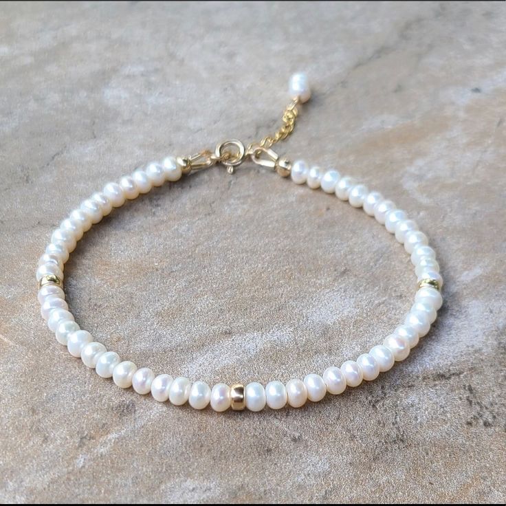 Freshwater Pearl Bracelet Item Description ********************** Handmade In Usa Freshwater Pearls, 4mm 14k Gold Filled Rondelle, 4mm 14k Gold Filled Spring Ring Clasp, 5.5mm 14k Gold Filled Extended Chain, 1 Inch Pearls Are 100% Genuine Made To Order In Sterling Silver Length 6.5”+1” Inch Extender Chain ( Custom Length Is Available ) White 14k Gold Filled Jewelry For Anniversary, Classic White 14k Gold Filled Jewelry, Delicate White Beaded Round Bracelets, White Single Strand Bracelet Gift, White Single Strand Bracelet As A Gift, Classic White Pearl Bracelet With 14k Gold Fill, Delicate White Pearl Bracelet For Anniversary, Elegant White Pearl Bracelet 14k Gold Filled, Elegant White Pearl Bracelet In 14k Gold Filled