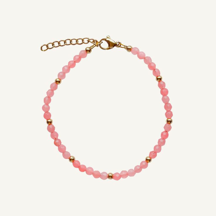 A wearable embrace of the rosy warmth of summer's embrace. This beaded stacking bracelet captures the essence of a sunlit dawn, exuding the delicate blush of blooming petals. Wear it alone for a subtle pop of color, or layer it with other pieces to craft your own personalized palette of shades. Its flexible design ensures comfort without compromise on style. Created with a stainless steel base and utilizing an extra luxurious 18 karat gold plating for the perfect, water & sweat proof finish. 18k Elegant Adjustable Crystal Bracelet For Spring, Pink Faceted Beaded Bracelets For Everyday, Pink Faceted Beads Jewelry For Everyday, Everyday Pink Beaded Bracelets With Faceted Beads, Feminine Adjustable Bracelets With Round Beads, Beaded Bracelets For Everyday Spring Wear, Everyday Pink Faceted Beads Jewelry, Everyday Pink Jewelry With Faceted Beads, Everyday Beaded Bracelets For Spring