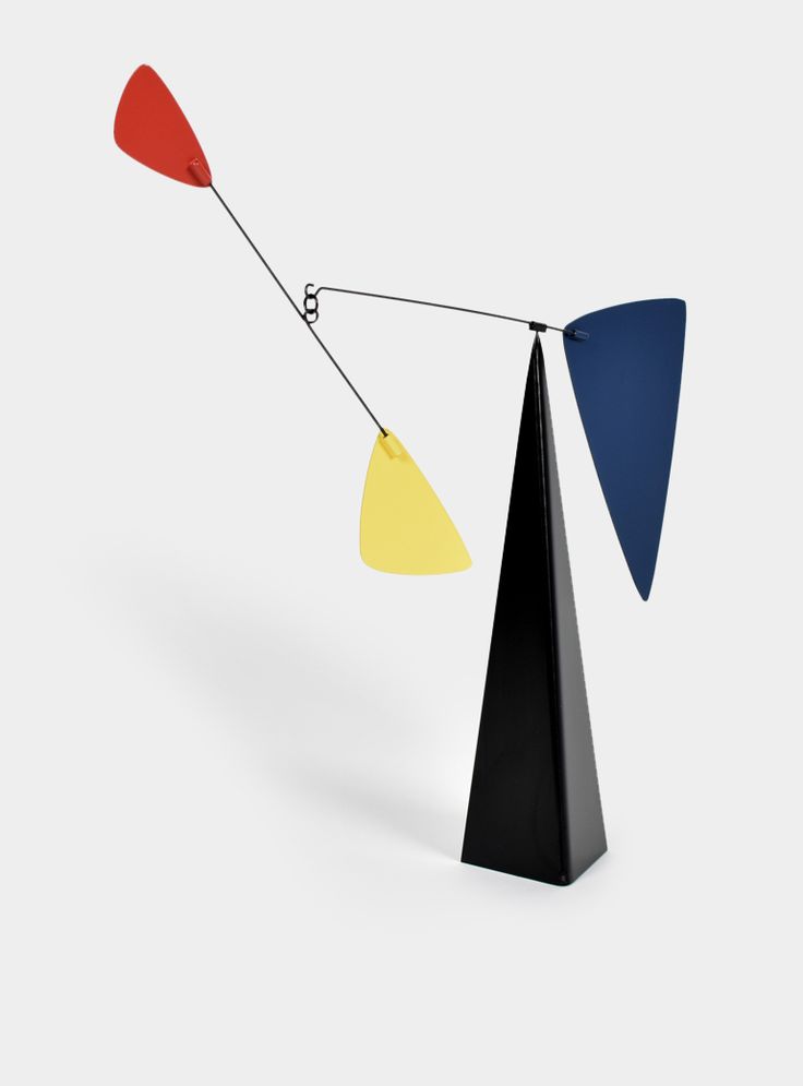 an abstract sculpture with three different colored shapes on each side and one hanging upside down