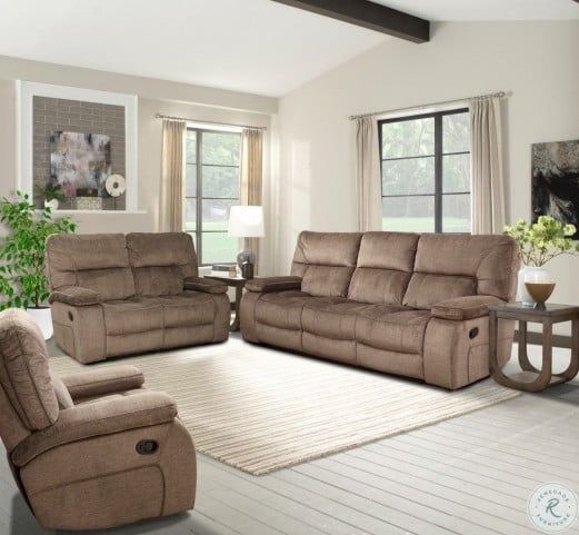 a living room with two recliners and a couch in it's center