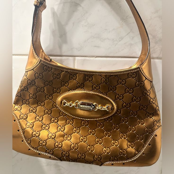 Rare Metallic Bronze Gucci Bag. Like New, Authentic And Ready For A New Home. I’ve Searched To Try To Price This Bag The Best I Can And This Metallic Bronze Color Way Is Super Rare (Pics Attached Of Other Styles I’ve Found). The Inside Is Clean, Original Hardware. Designer Shoulder Bag With Branded Hardware, Classic Gold Bag With Horsebit Detail, Designer Pre-owned Shoulder Bag, Designer Gold Shoulder Bag With Dust Bag, High-end Gold Shoulder Bag, Luxury Shoulder Bag With Horsebit Detail For Evening, Elegant Gold Shoulder Bag With Horsebit Detail, Designer Formal Pre-owned Shoulder Bag, Designer Pre-owned Rectangular Shoulder Bag