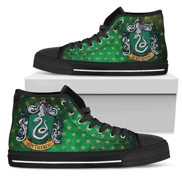 a pair of green shoes with the hog potter crest on them, sitting on top of a