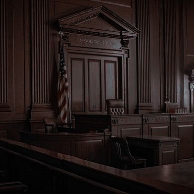 an empty courtroom with the lights on