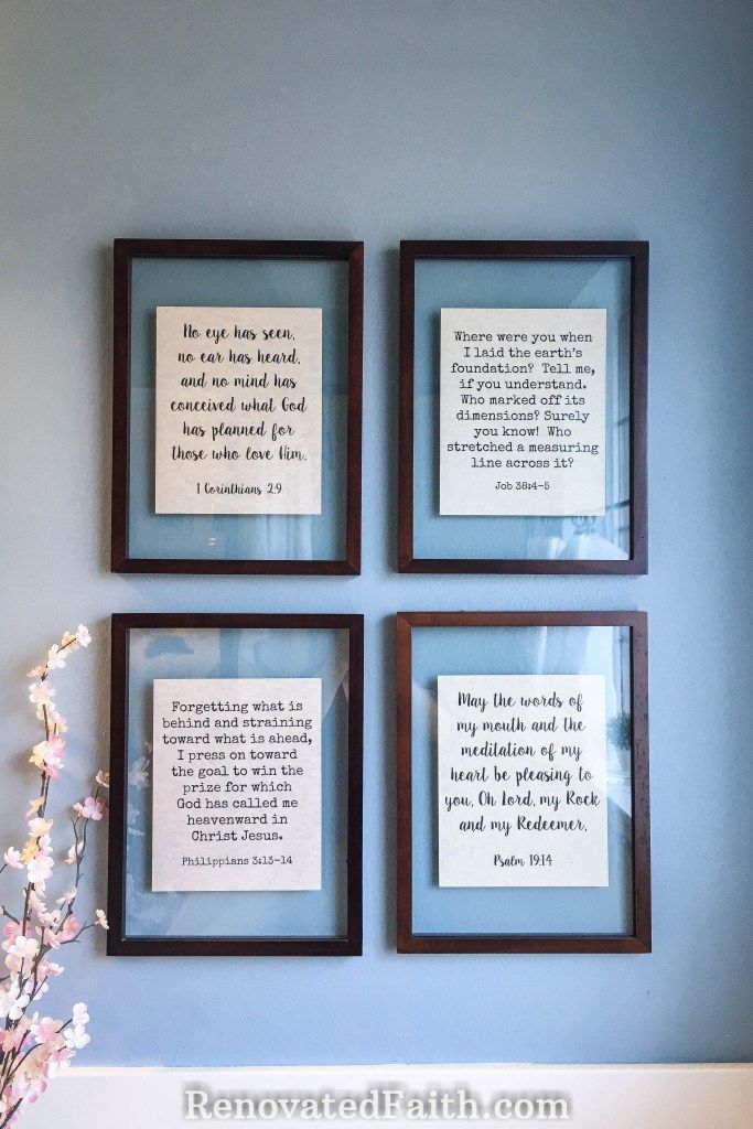 three framed pictures on the wall above a vase with flowers in it and some bible verses