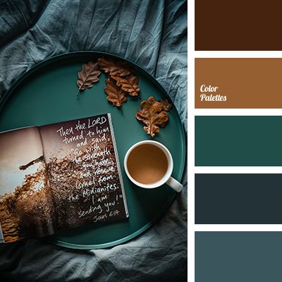 a cup of coffee next to an open book and some leaves on a plate with color swatches