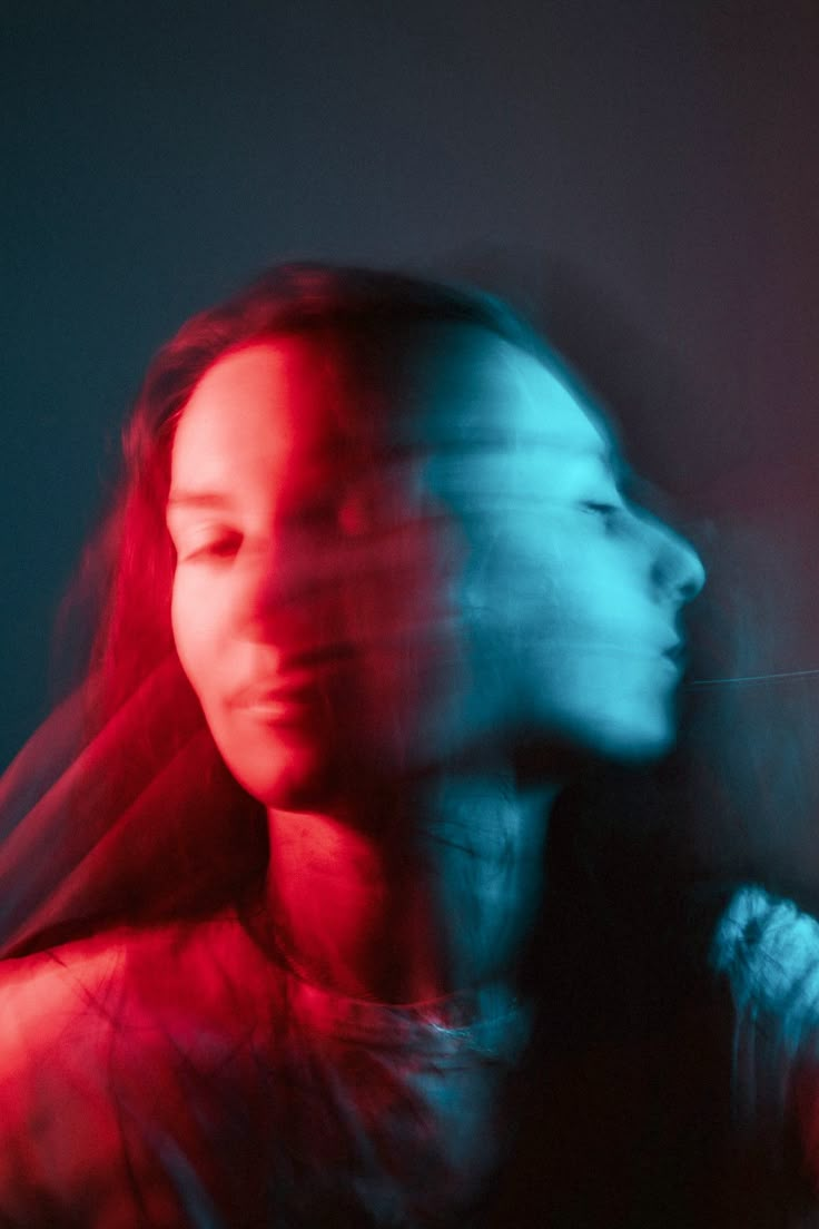 a blurry photo of a woman with long hair