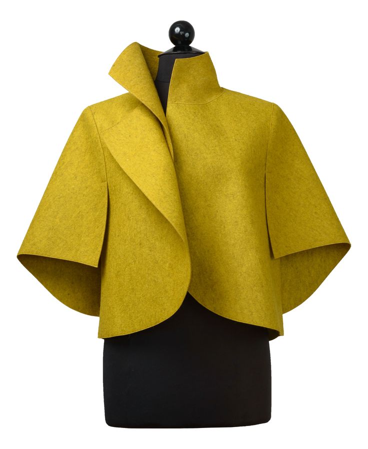 Wool Jacket - Dynamic proportions and crisp angles make this sculptural jacket an easy-to-wear statement piece. The artists unique arm awning sleeve design is open on bottom, providing both coverage and freedom of movement. Felted merino wool feels soft against the skin, yet is substantial enough to hold its shape for years of wear. Chic Merino Wool Outerwear For Work, Modern Merino Wool Outerwear For Fall, Elegant Merino Wool Outerwear For Spring, Spring Merino Wool Outerwear For Work, Modern Wool Blazer For Spring, Modern Structured Wool Coat, Chic Fitted Merino Wool Outerwear, Fitted Merino Wool Outerwear For Work, Modern Structured Cropped Jacket For Fall