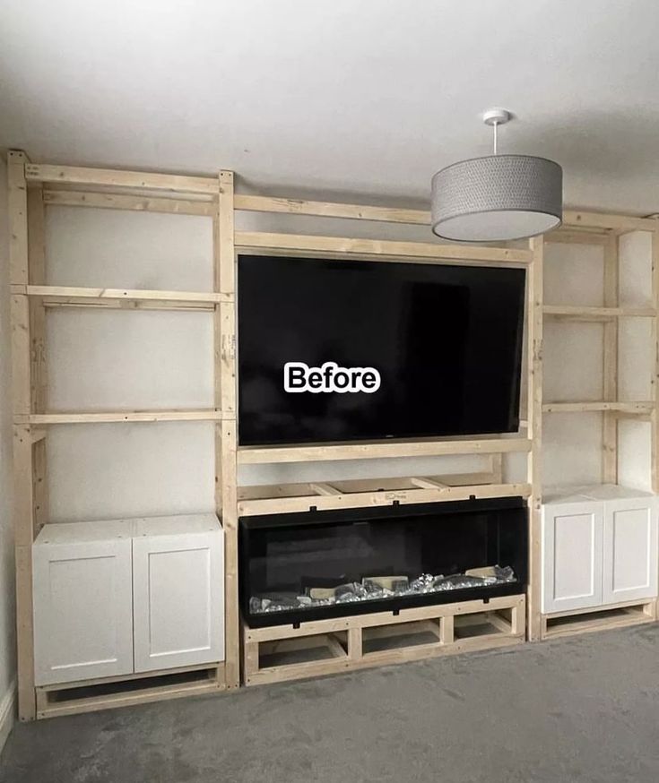 an entertainment center with built in cabinets and a flat screen tv mounted to the wall