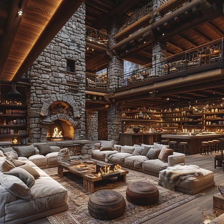 a living room filled with lots of furniture and a fire place in the middle of it