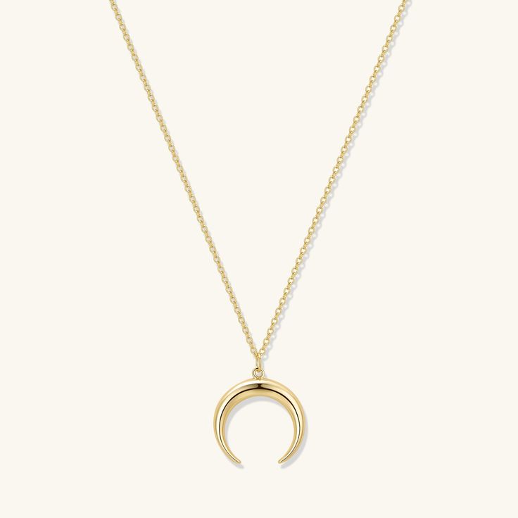 A nature-inspired crescent tusk pendant evokes an effortless bohemian vibe. The best selling Crescent Pendant Necklace is a golden staple that can be worn with any outfit, everyday, layered up or styled as a statement. - 18k gold plated- Pendant size 16.6 x 17 mm.- Adjustable chain 16 to 18 in.- 1 Year warranty Gold Moon And Star Necklace, Minimalist Gold-plated Necklace With Moon Charm, Yellow Gold-plated Necklaces With Moon Charm, Gold Tarnish-resistant Moon Necklace, Gold Moon-shaped Celestial Charm Necklace, Tusk Pendant, Crescent Moon Necklace Silver, Crescent Moon Necklace Gold, Crescent Moon Pendant