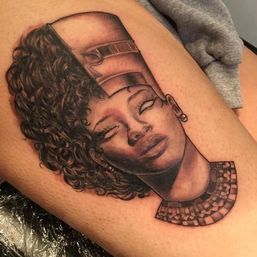 a woman's thigh with an image of her face on it